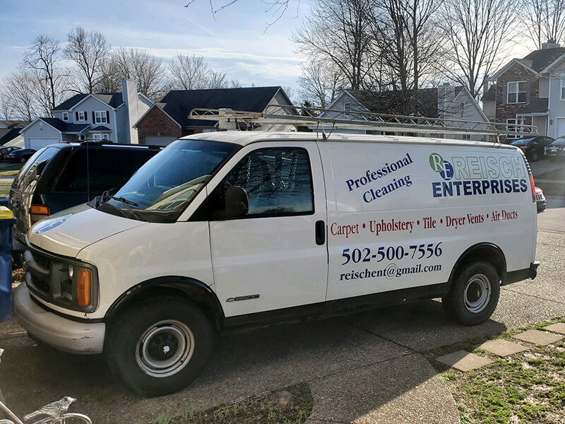 Reisch Enterprises work van sitting in a drive way